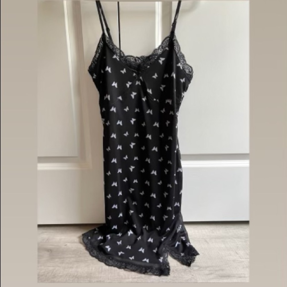 black mini dress with white butterflies